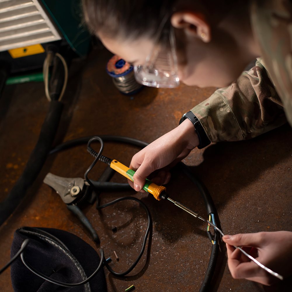 Servicewoman works on some wiring